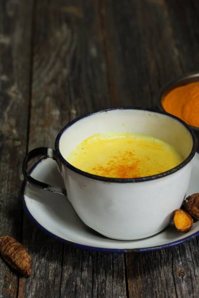 istock Turmeric Drink /  Golden Milk  on dark moody background, selective focus 651856252