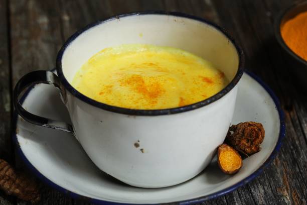 istock Turmeric Drink /  Golden Milk  on dark moody background, selective focus 651856412