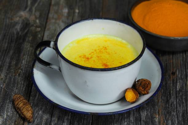 istock Turmeric Drink /  Golden Milk  on dark moody background, selective focus 651856840