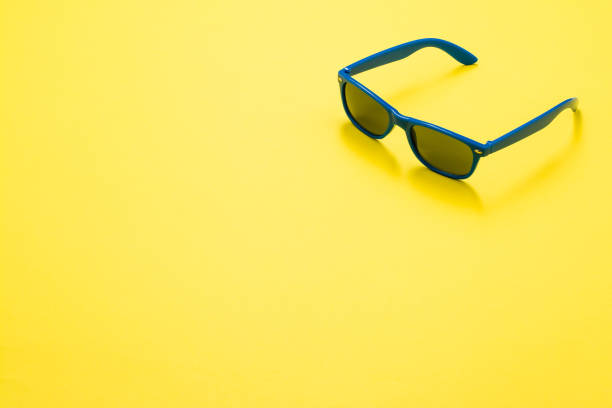 istock Sunglasses on colorful background with copy space 651890256