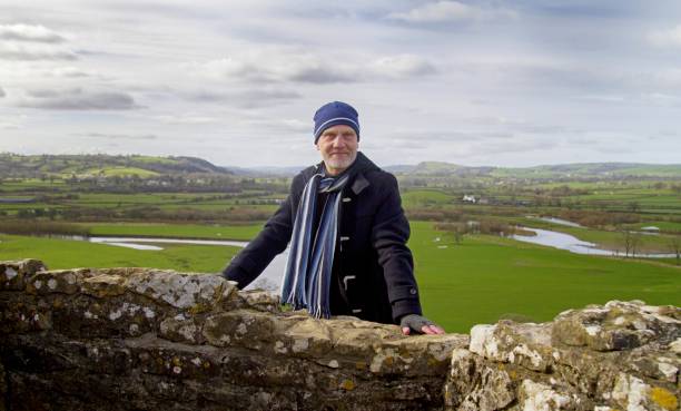 istock Mature man with countryside background 651891196