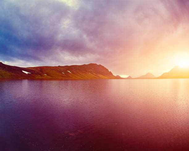 istock Lake coast with mountain reflection, Iceland 651927162