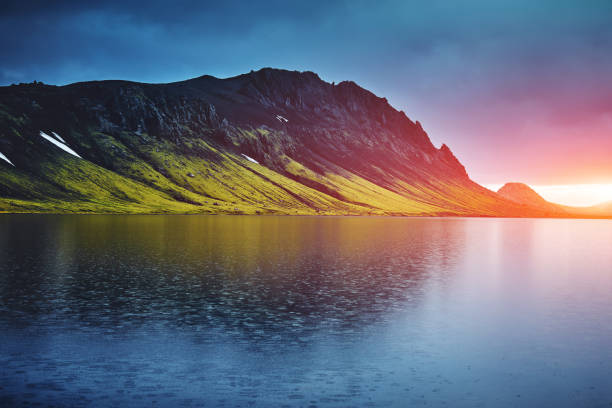 istock Lake coast with mountain reflection, Iceland 651930116