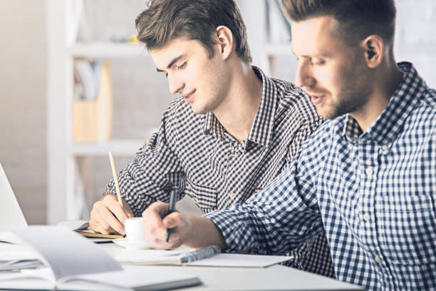 istock Portrait of white men doing paperwork 651944570