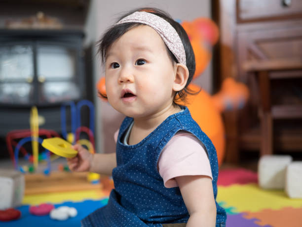 istock baby girl learning alphabet 651967868