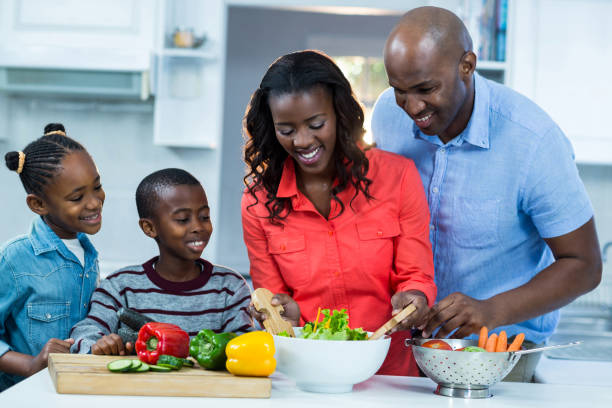 istock Happy family preparing food 652048614