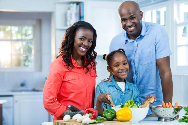 istock Happy family preparing food 652049126