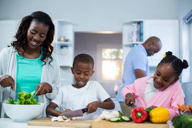 istock Happy family preparing food 652051794