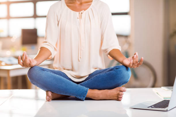 istock Female business executive performing yoga 652115972