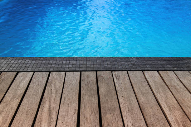 istock Blue swimming pool with summer vacation and wooden deck 652116326