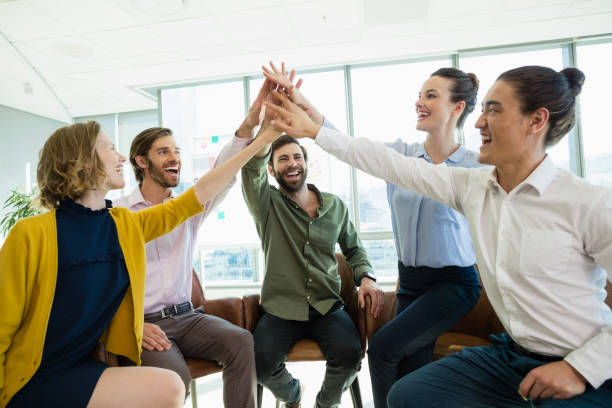 istock Business executives giving high five to each other 652118942