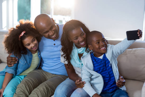 istock Family taking selfie from mobile phone 652127404