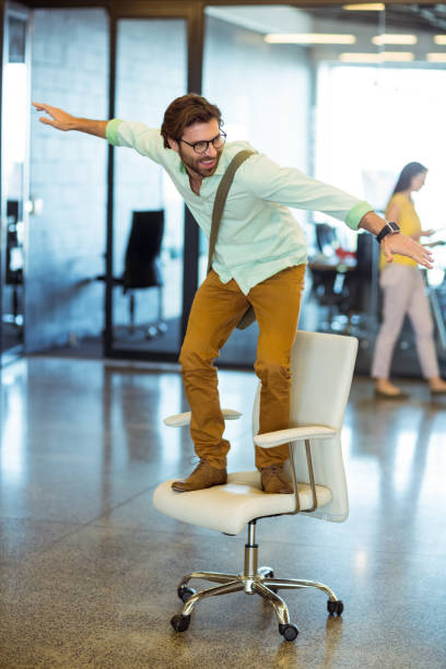 istock Male business executive standing on chair 652127560
