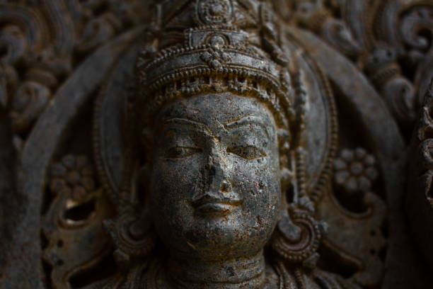 istock Destroyed face of Deity sculpture under eves on shrine outer wall in the Chennakesava temple at Somanathapura,Karnataka,India 652134128