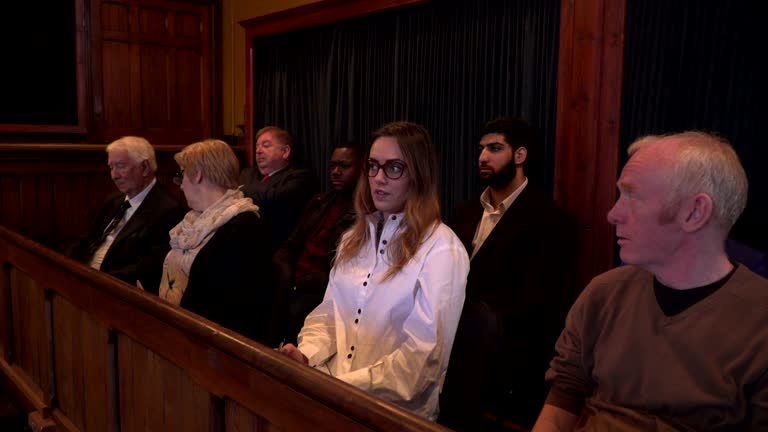 4K DOLLY: Jury looking unimpressed in a Courthouse