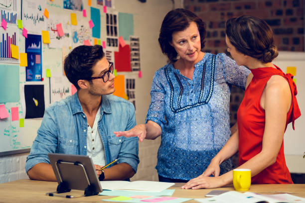 istock Business people discussing over digital tablet 652137872