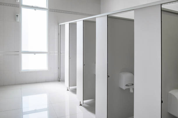 istock Clean men public toilet room empty with big window and light from outside, 652144140