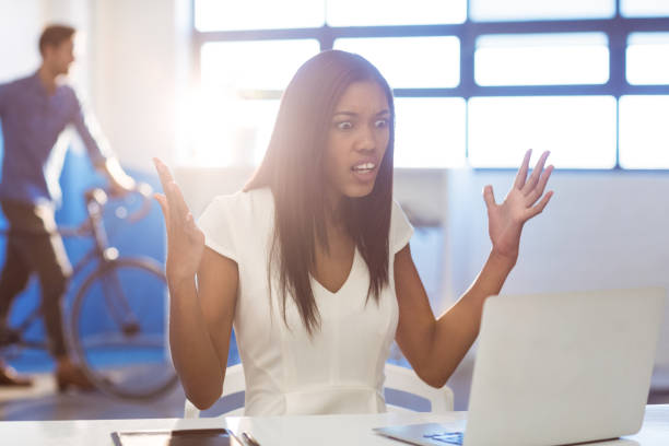 istock Shocked business executive looking at laptop 652151112