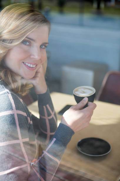 istock Woman having coffee in cafeteria 652158556