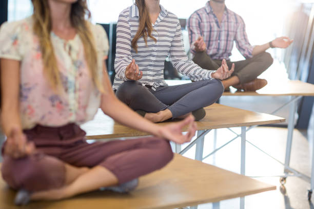 istock Business people performing yoga on table 652159212