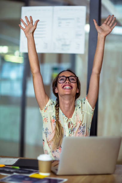 istock Excited graphic designer sitting with laptop 652159356