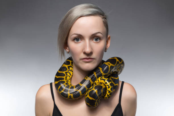 istock Woman with snake on her neck 652161702
