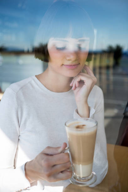 istock Woman having milkshake in cafeteria 652168312