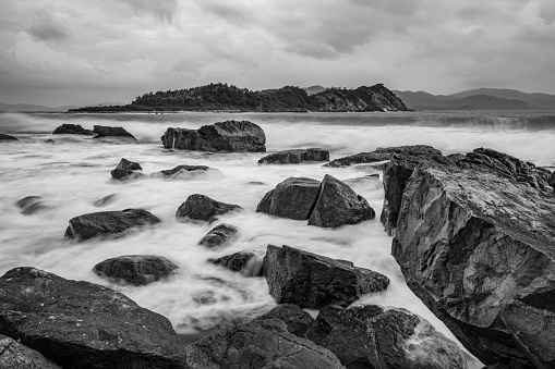 Rocky coastline on the south China sea off the coast of Vietnam with a colourful sky.