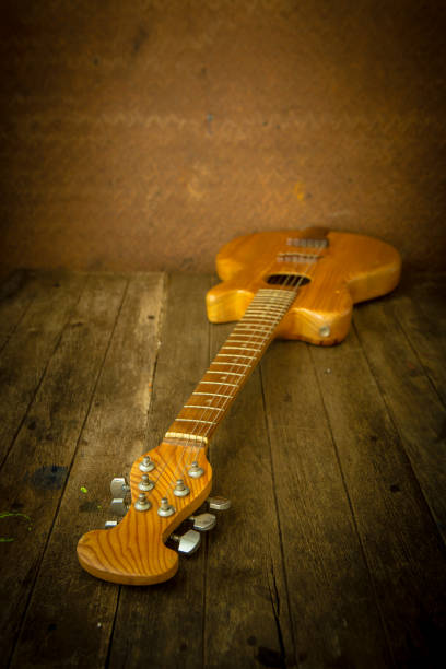 istock Acoustic guitar on wood background 652173458