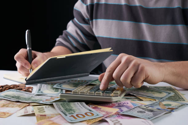 istock Businessman or accountant using calculator with accounting report 652179442