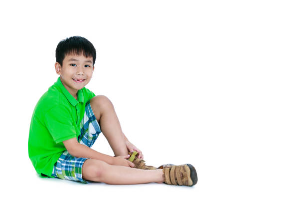Side view of asian child smiling. Isolated on white background. stock photo