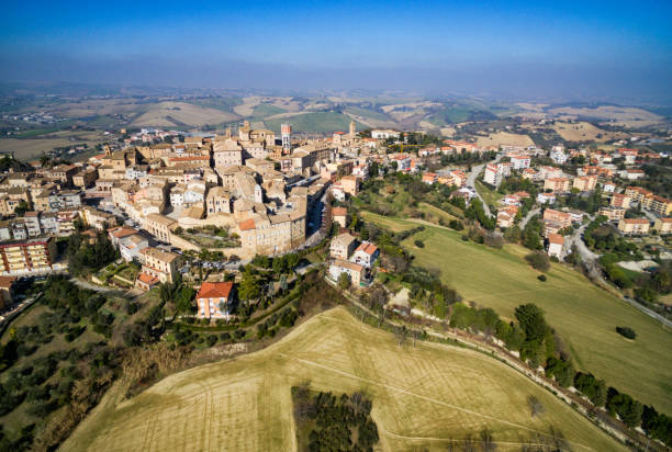 Filitrano, Le Marche, Italy.  Drone Aerial View of the town and countryside. Filitrano, Le Marche, Italy.  Drone Aerial View of the town and countryside.  Views of olive groves, vineyards and the ancient stone village on the hilltop. marche italy stock pictures, royalty-free photos & images