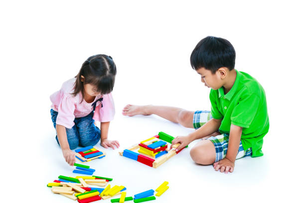 istock Children playing toy wood blocks, isolated on white background. 652183978