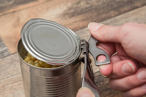 istock Old opener open to metallic can. Canned corn. Healthy eating. 652184338