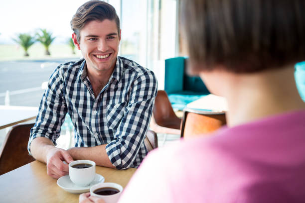 istock Man talking to a woman in coffee shop 652184552
