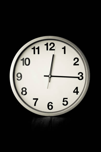 istock white clock on a table with old steel background,black and white tone 652184600
