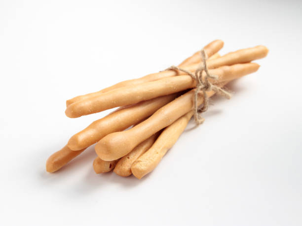 istock Homemade bread sticks on white background,with rope bundle. 652184760