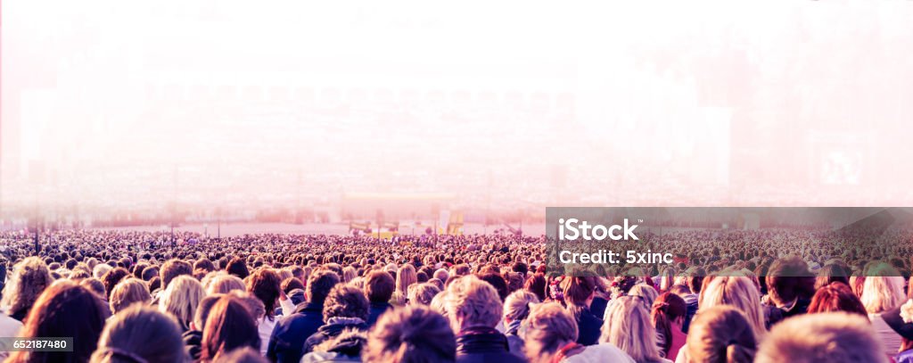 Large crowd of people Panoramic photo of large crowd of people. Slow shutter speed with motion blur. Music Festival Stock Photo