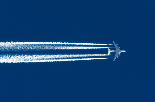 airplane big four engines aviation airport contrail clouds - rasto de fumo de avião imagens e fotografias de stock