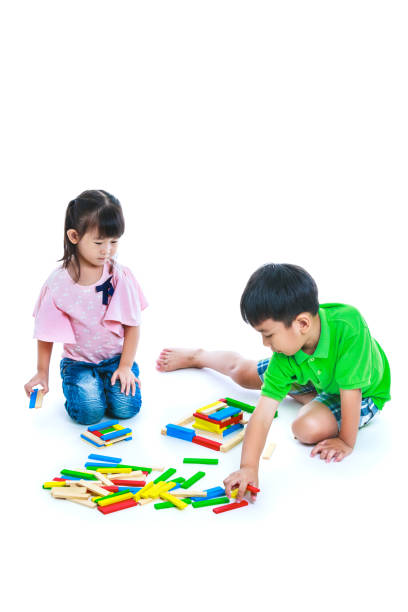 istock Children playing toy wood blocks, isolated on white background. 652187850