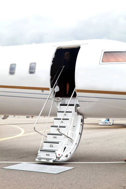 istock White private business jet and open ladder 652194904