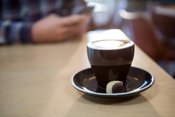 Cup of a coffee on the table in coffee shop