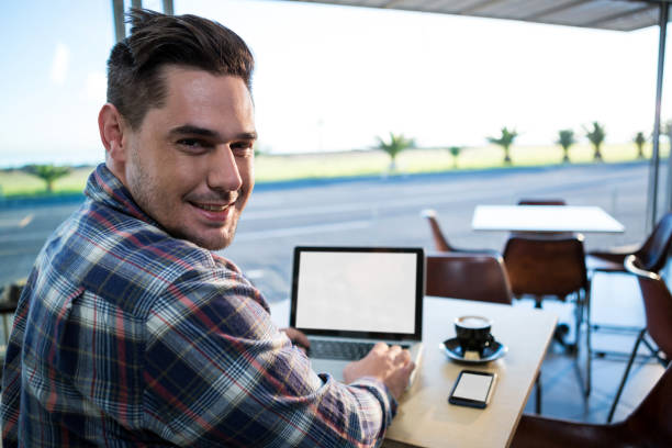 istock Man using his laptop in coffee shop 652195438