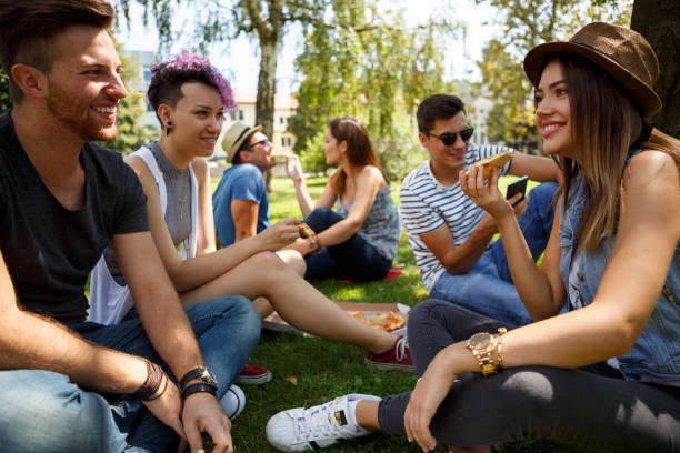 istock Friends eating pizza outside 652199936