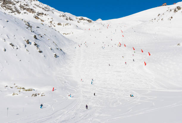 istock Skiers on a piste in alpine ski resort 652202420