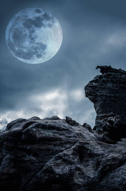 istock Boulder against sky with clouds and beautiful full moon. 652207286