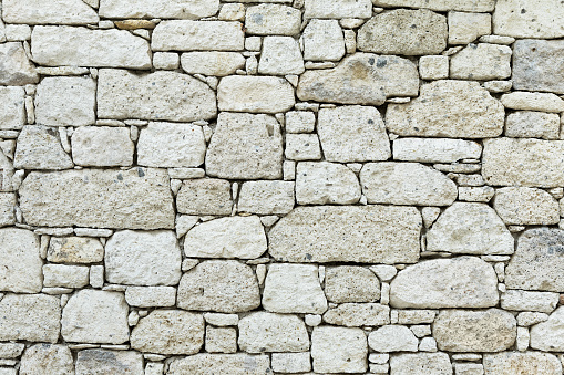 White stone wall textured background.