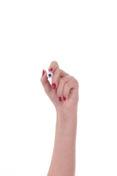 istock Woman hand holding marker isolated on white 652221744