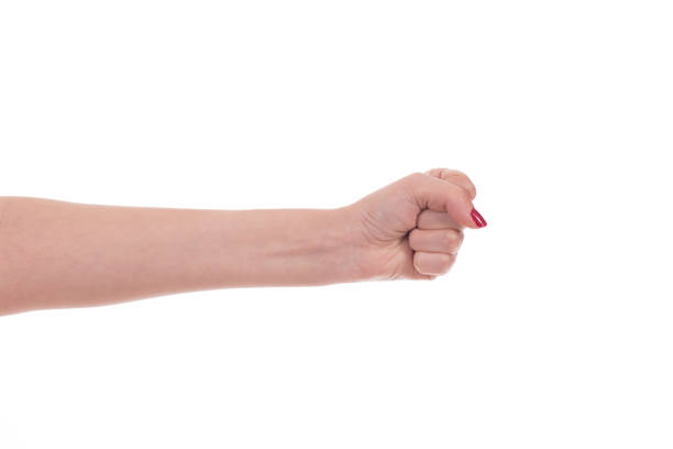 femme poing sur blanc - knuckle human skin close to color image photos et images de collection
