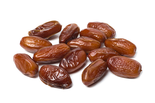 Sweet dry dates isolated on white background